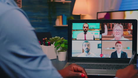 African-american-employee-discussing-during-video-meeting