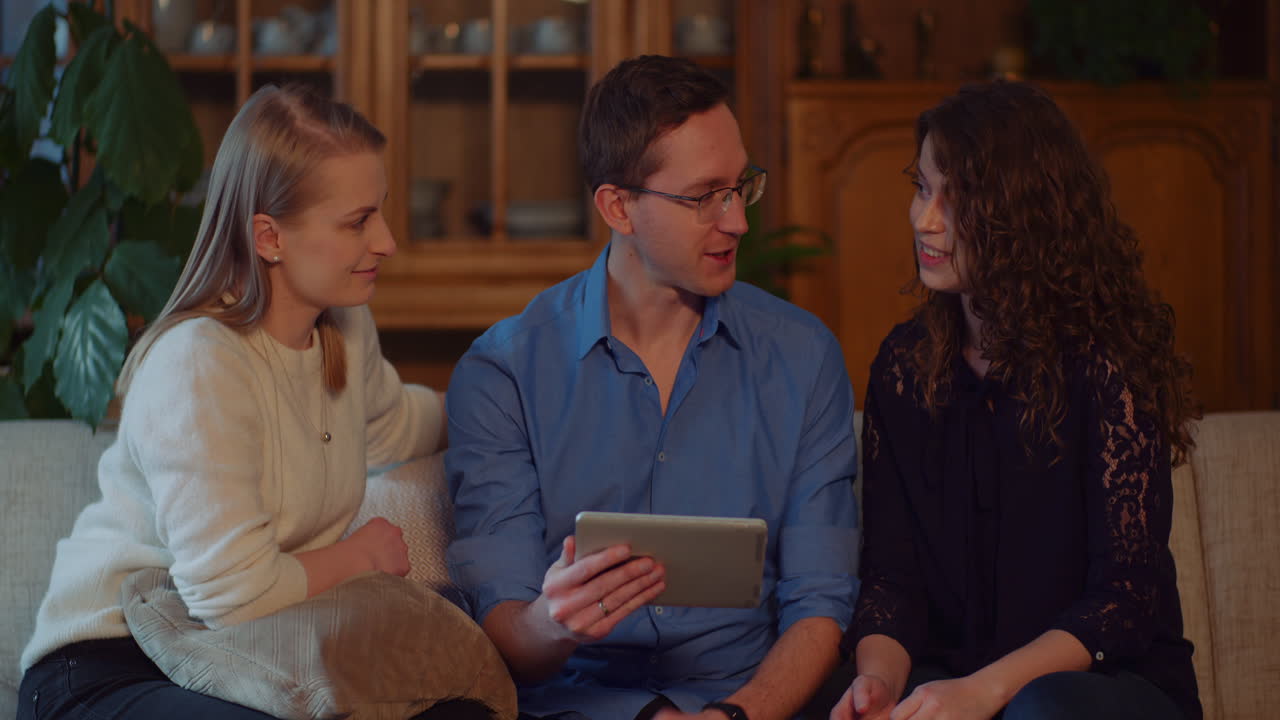 People looking at a tablet together