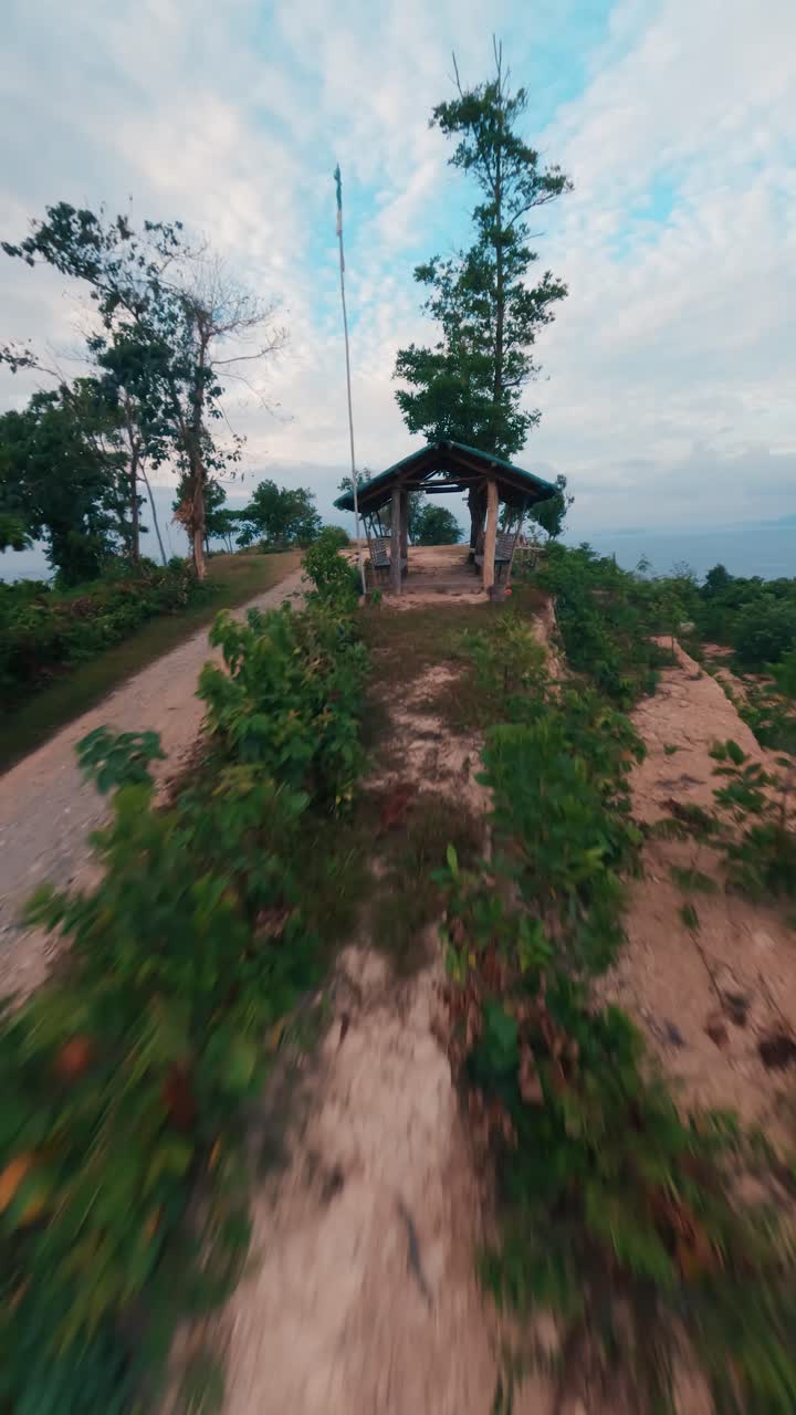 FPV Drone Flight Over Rugged Coastline and Tropical Waters at Hundred Steps Beach in San Vicente, Palawan, Philippines – Vertical Aerial Perspective