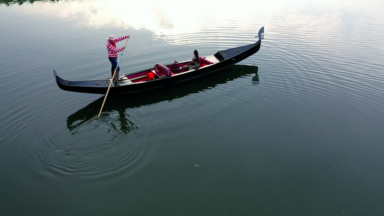 City river with gondola. Tourists in gondola ride on the city river
