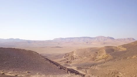 desert landscape over mitzpe ramon crater in the negev fly by 02