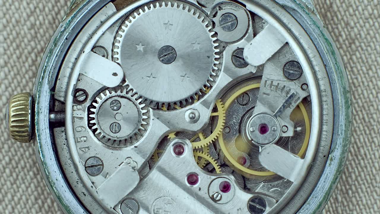 Old vintage clock mechanism working, closeup shot with soft focus