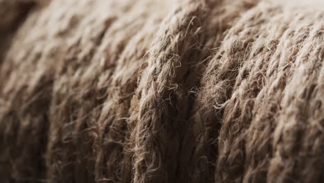 micro video of close up of grey woolly threads with copy space