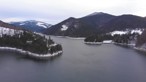 aerial view with the lake from valea draganului at winter time in romania