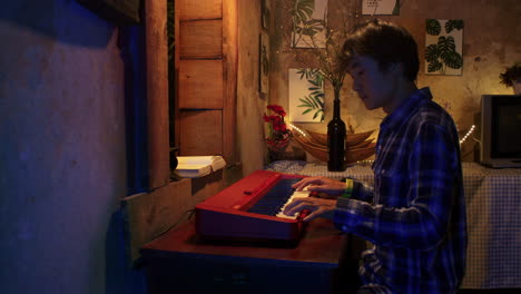 Side-Portrait-Of-An-Asian-Man-Playing-Piano-Keyboard-At-Home-In-The-Evening