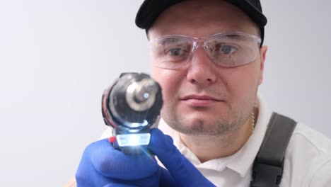 man holding a drill