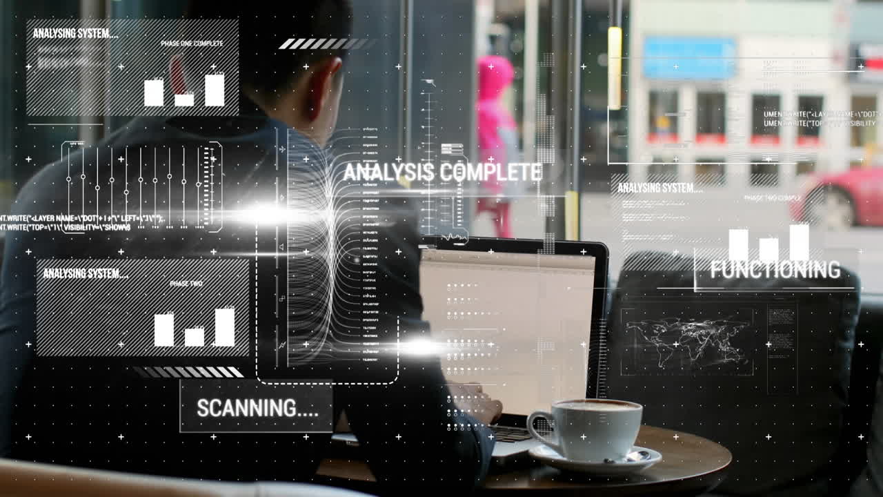Animation of interface with data processing over rear view of businessman using laptop at a cafe