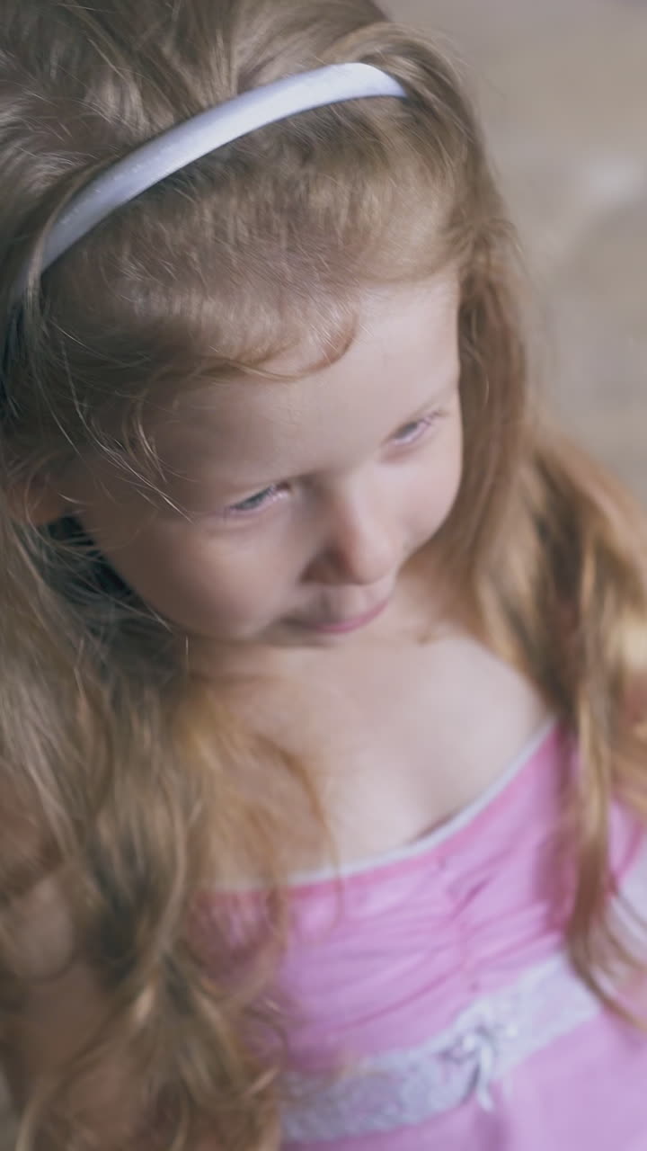 careful woman sprays throat of ill little girl using effectively remedy on bed in light children room close view