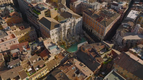High-angle-view-of-famous-Trevi-Fountain-with-sculptures-and-turquoise-water.-Aerial-view-of-tourist-sight.-Rome,-Italy