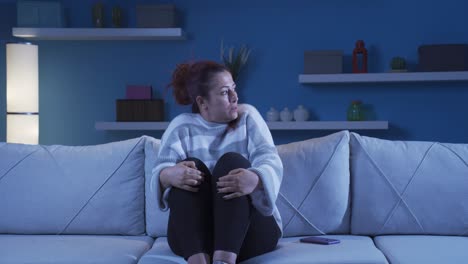 fearful woman. she is in a bad mood at home.