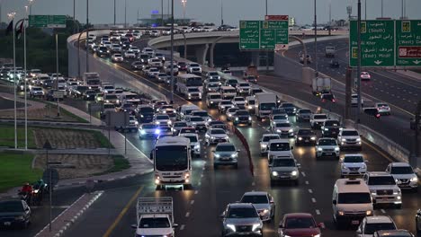 Slow-moving evening traffic on Nadd Al Hamar Road in Dubai, heading towards Sharjah, United Arab Emirates.