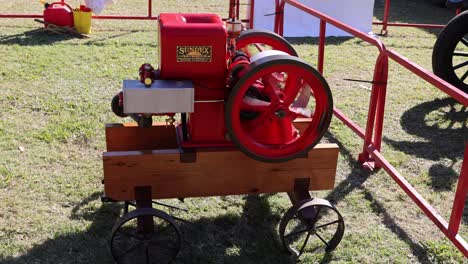 old-fashioned engine rotates on display outdoors