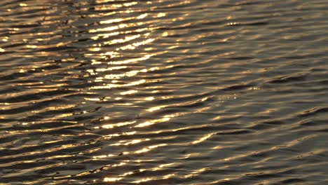 Sonnenuntergangansicht-Des-Hintergrundmeerwassers