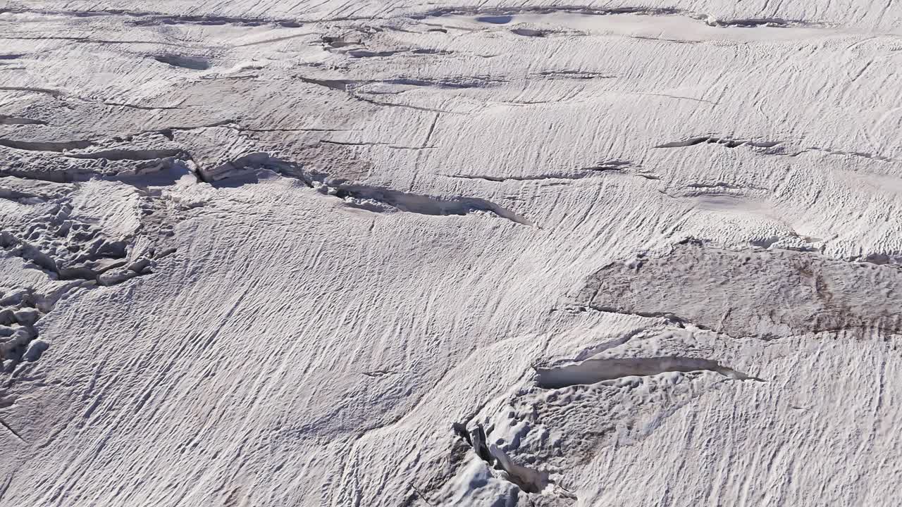 Aerial View of a Glacier with Crevasses