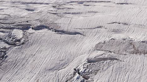 aerial view of a glacier with crevasses