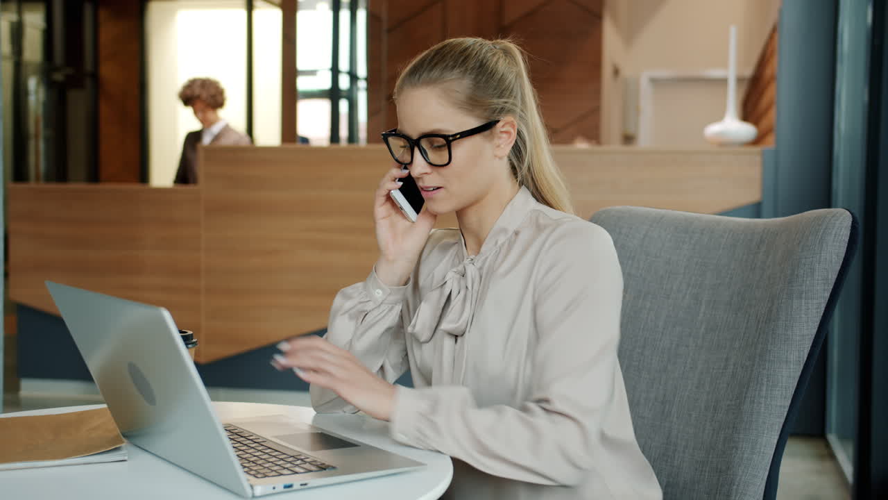 Businesswoman working in a hotel lobby