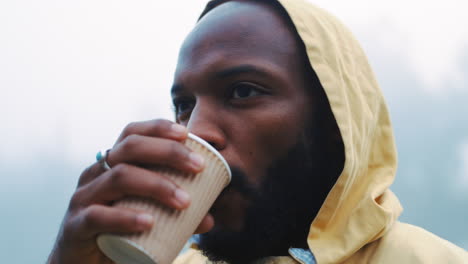 coffee, morning and black man hiking in the woods