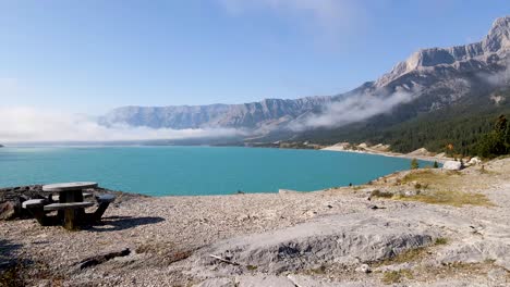 beautiful low angle view of rocks, mountains and clouds around abraham lake