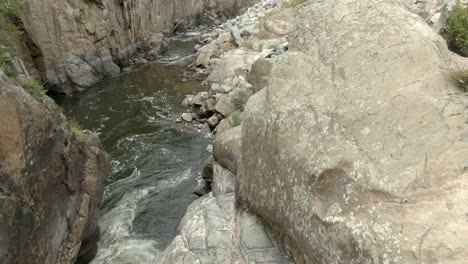 aerial dolly following river in canyon downstream in colorado