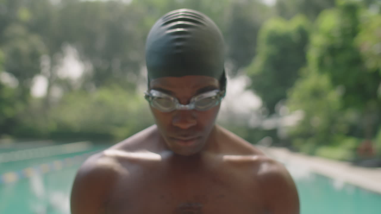 Portrait of Confident Swimmer in Cap and Goggles