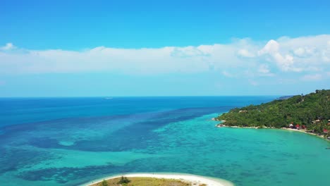 tropical-island-with-palm-trees,-coconut-forest,-surrounded-by-emerald-water-with-diverse-marine-life,-Koh-Phangan-Thailand