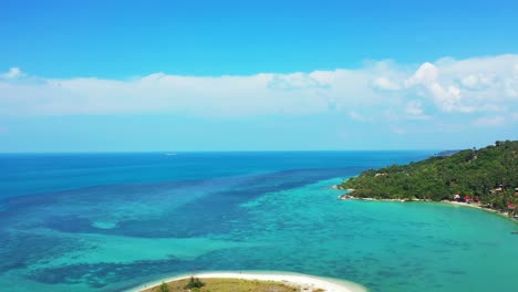 tropical island with palm trees, coconut forest, surrounded by emerald water with diverse marine life, koh phangan thailand