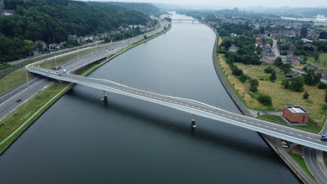 aerial view of a bridge over a canal with highway traffic