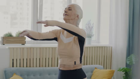 Senior Woman Doing Stretching Exercises at Home