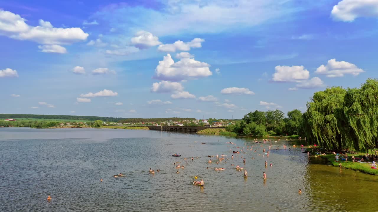 People swimming at stream river. Aerial view of people swimming in the river