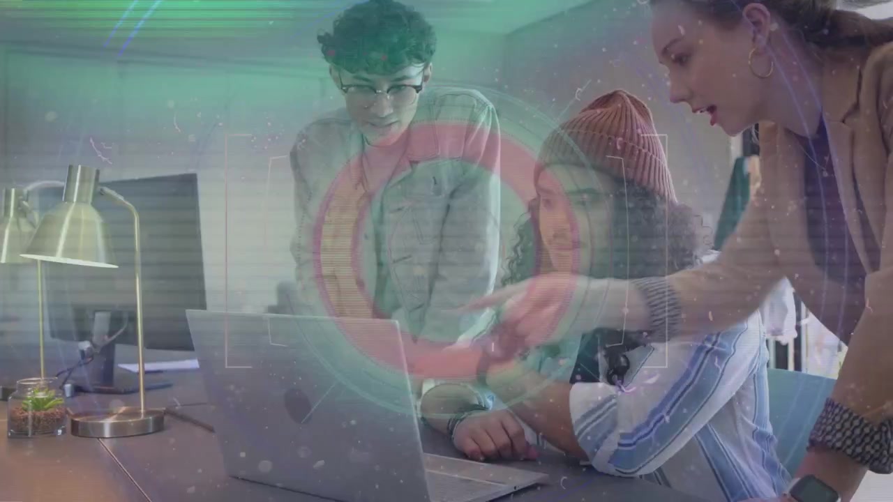Holo overlay pulsing team gathering around laptop woman pointing beanie user typing fixing tech bug