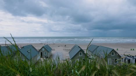 beach huts on a cloudy day