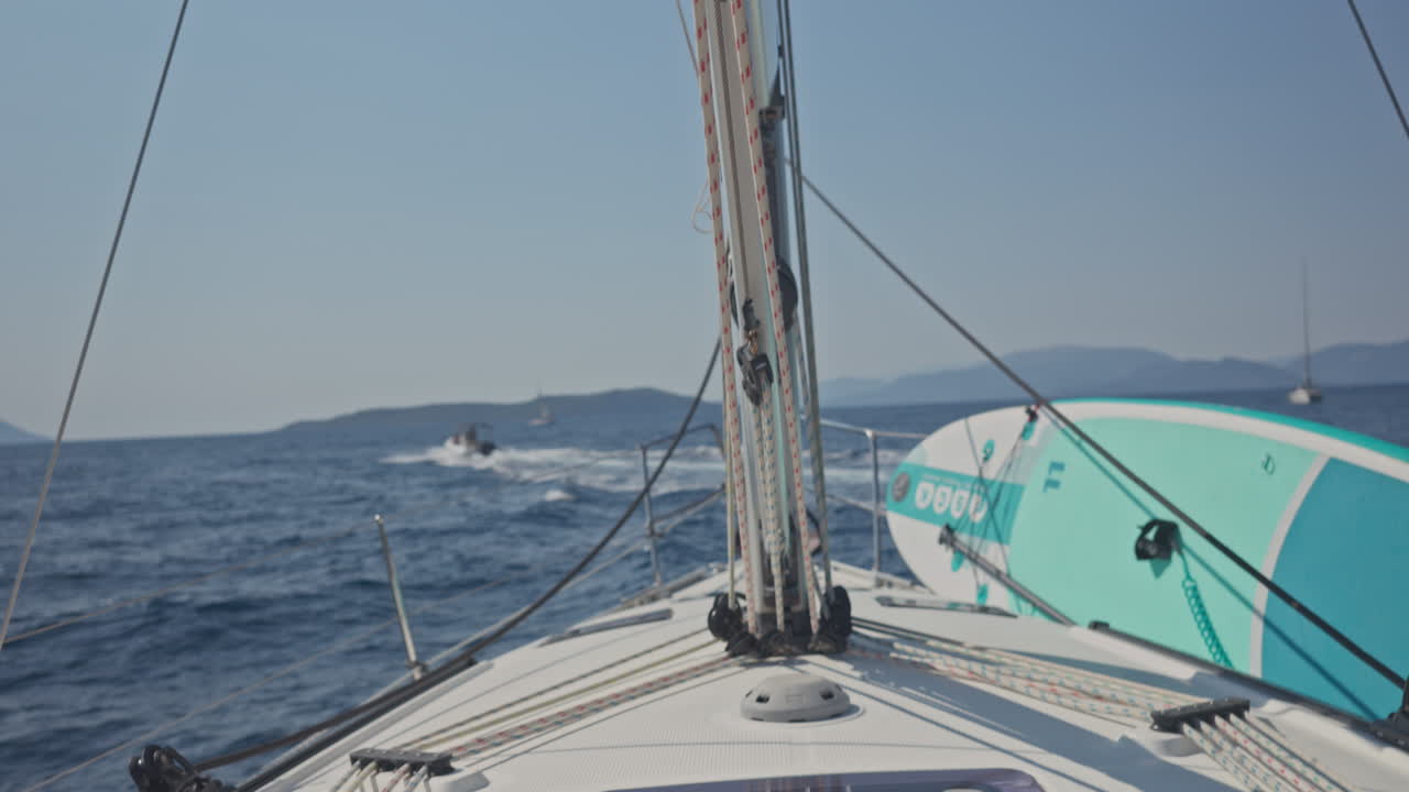 view from a yacht of a greek island at sunrise