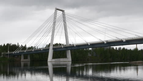 the kolbäck bridge and ume älv, in umeå, sweden, static shot followed by pan right, 10-bit