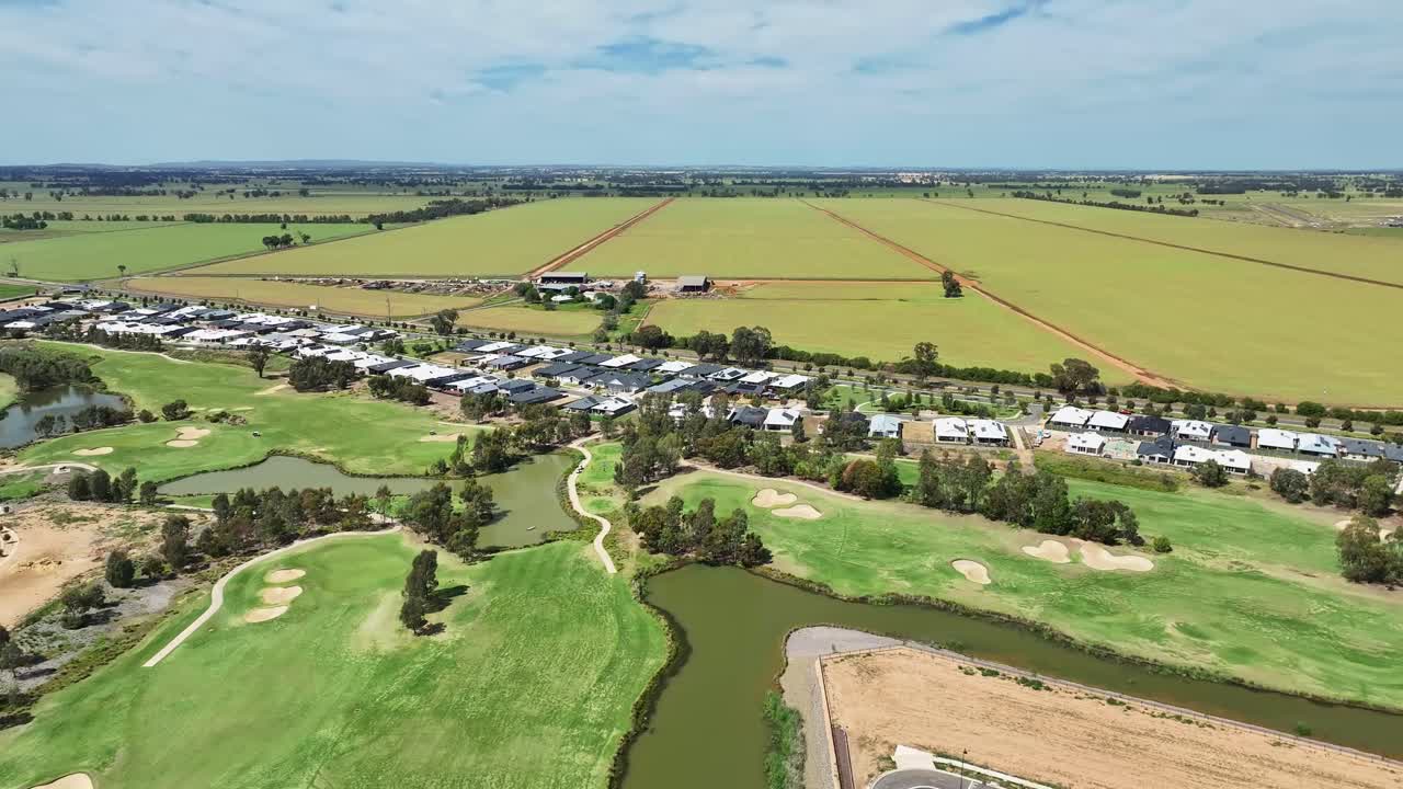 Aerial overview of residential growth near Black Bull Golf Club and open fields