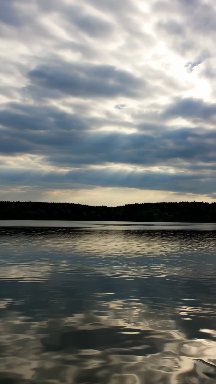 Cloudy Sunset over a Lake with Forest