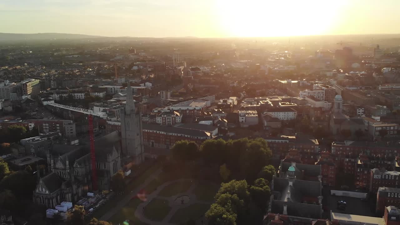 Dublin City Cathedral St Patricks during sunset over the cityscape, aerial drone