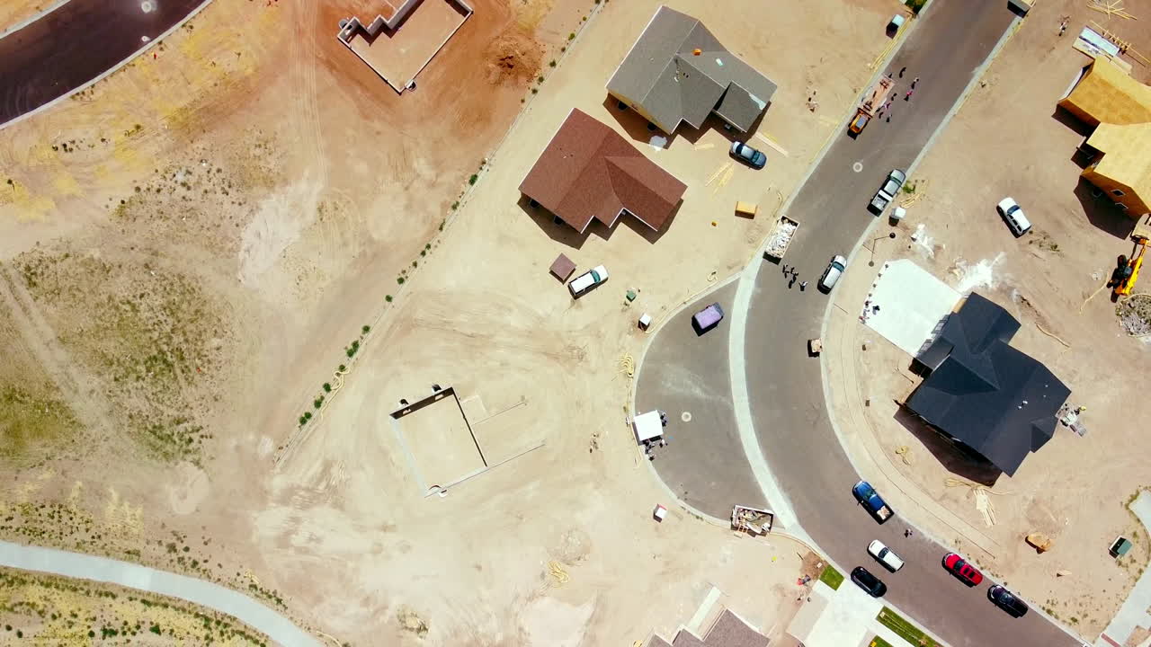 Fly over looking down on Construction in New Subdivision build