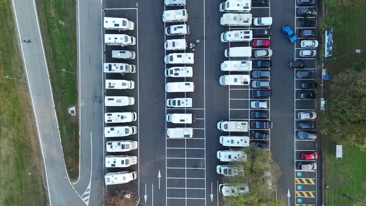 Aerial view highlighting numerous RVs and campers parked at the dedicated facility in Piazzale Azzurri d'Italia, Cremona