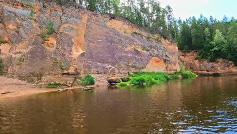 Panoramic-Landscape-brown-red-soil-river-Erglu-Klintis-Cliff-Latvian-Gauja-National-Park-natural-environment-of-Latvia,-european-travel-hiking-spot