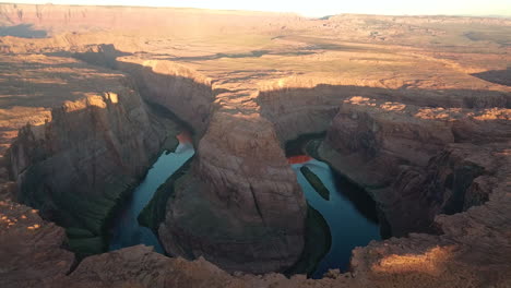 sunlight slowly illuminating the horseshoe bend,colorado river,arizona