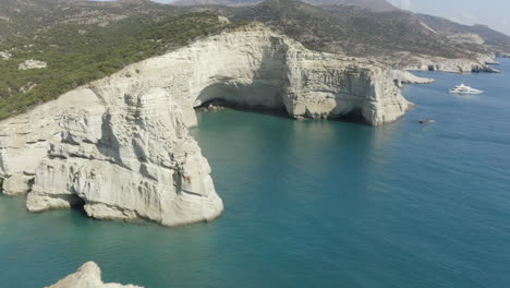 Klefitko-beach-and-white-cliffs-drone-aerial-shot-over-the-blue-waters-and-dramatic-coastline-of-the-greek-island-of-Milos,-Greece-in-4k