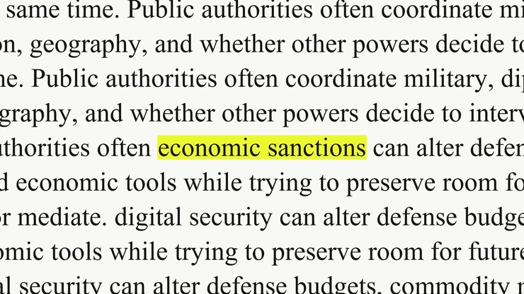 The words economic sanctions appear in a yellow highlight as black serif paragraphs change, with text about planning and reconstruction on a white background.