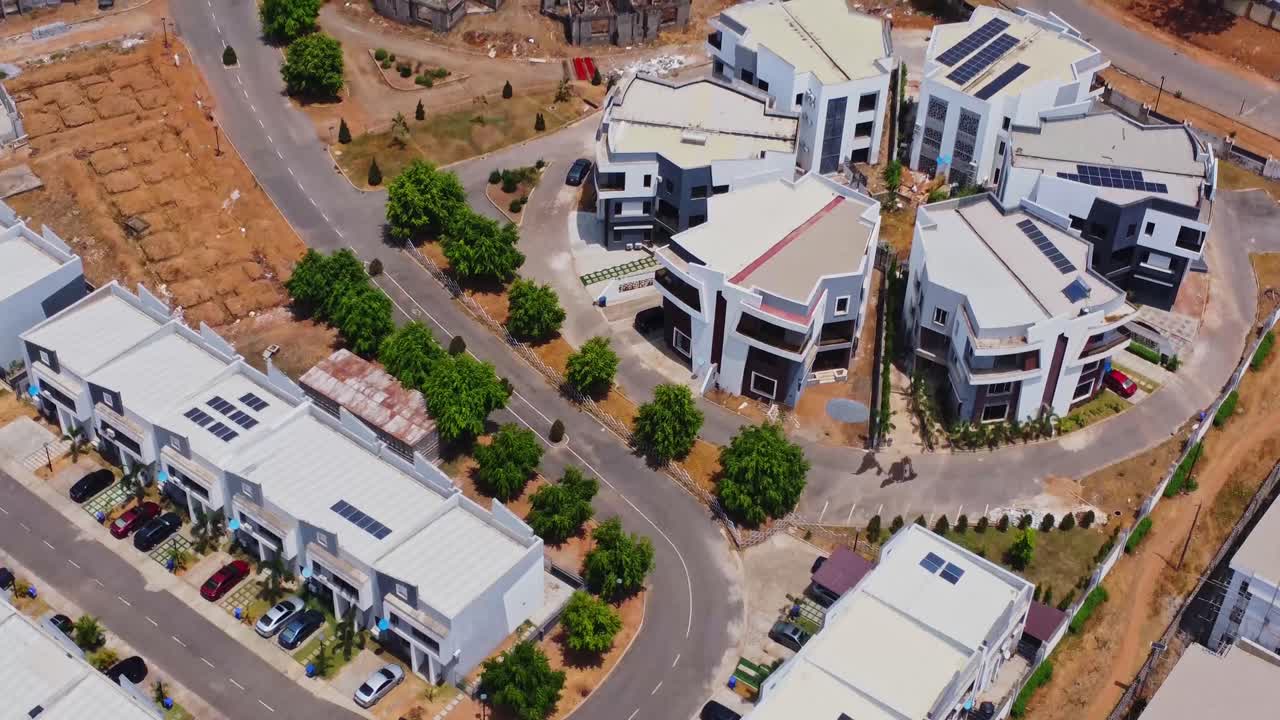 Beautiful aerial of luxury homes and apartments with photovoltaic solar panels on the rooftops in Abuja, Nigeria