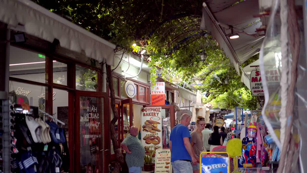 Night market shopping streets, small shops at old town of Petra, Lesvos island, Handheld gimbal shot