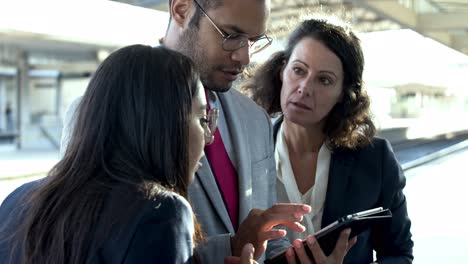 Focused-business-colleagues-with-digital-tablet
