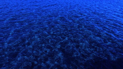 waves moving across a textured blue ocean