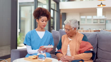 nurse discussing medication with elderly patient