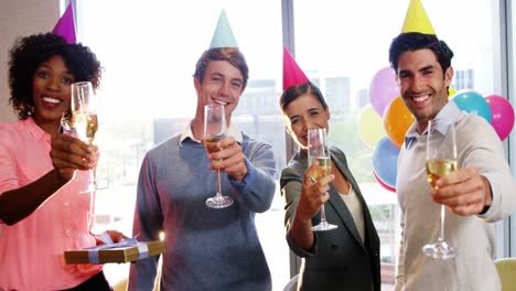 businesspeople showing glasses of champagne