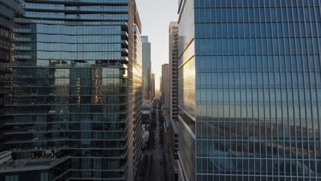 aerial shot of tall skyscraper glass office buildings in downtown district of austin, texas with cinematic light