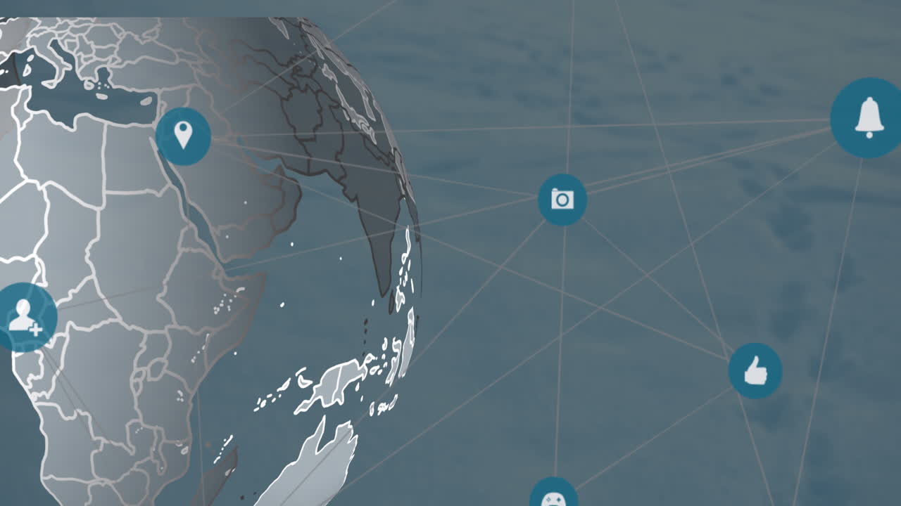 animación de una red de iconos digitales sobre un globo giratorio contra un fondo azul